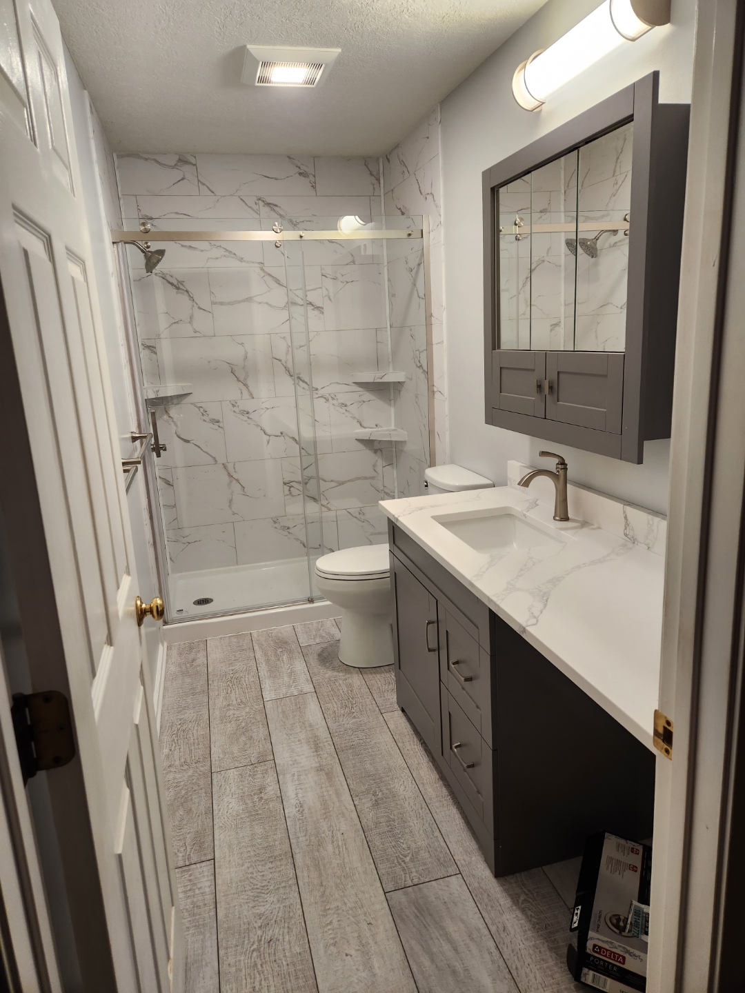 Modern Bathroom Remodel - Gray Vanity and Marble Shower