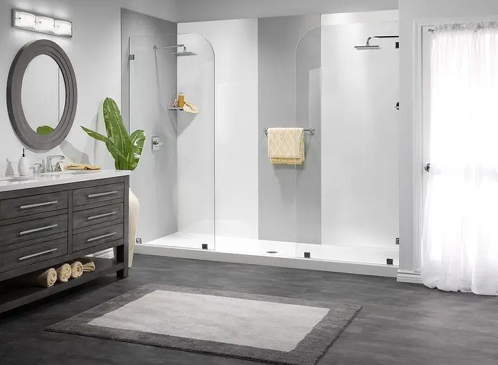 Modern white shower with glass doors and dark vanity